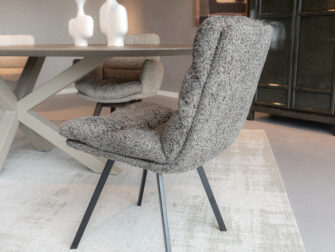 Comfortabele eetstoel met gepolijst stalen onderstel en luxe stof