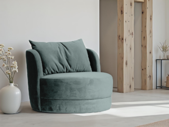 Fauteuil met afgeronde zitting en rug in blauwgroene stof, inclusief losse kussens